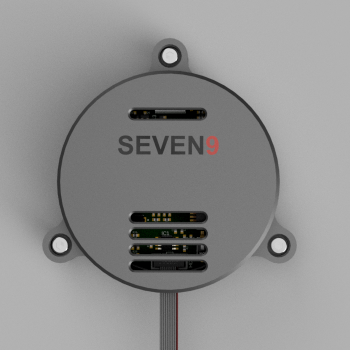 SEVEN9 branded circular electronics enclosure with exposed PCB and ribbon cable